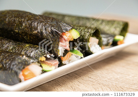 Close-up of handmade sushi rolls Close-up of handmade sushi rolls 111673329