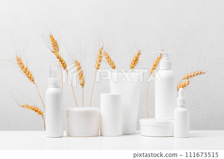 Cosmetic products on the table, white bottles and containers, mock-up scene Cosmetic products on the table, white bottles and containers, mock-up scene 111673515