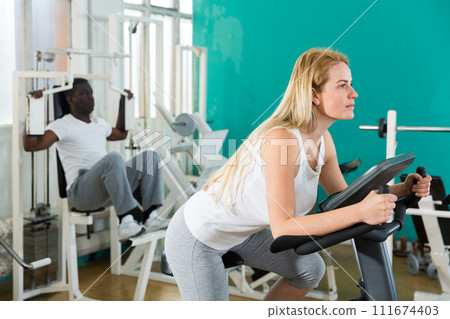 Group of people in sportswear exercising Group of people in sportswear exercising 111674403