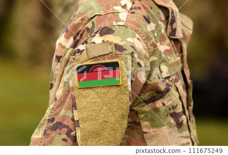 Malawi flag on soldiers arm (collage). Malawi flag on soldiers arm (collage). 111675249