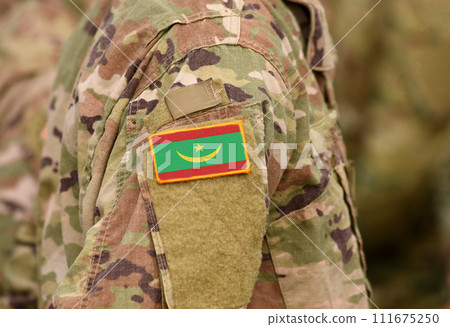 Flag of Mauritania on soldiers arm (collage). Flag of Mauritania on soldiers arm (collage). 111675250