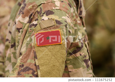 Morocco flag on soldiers arm. Morocco troops (collage) Morocco flag on soldiers arm. Morocco troops (collage) 111675252