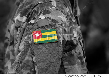 Flag of Togo on soldiers arm (collage). Flag of Togo on soldiers arm (collage). 111675350