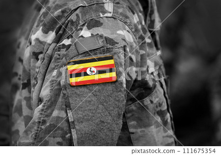 Flag of Uganda on soldiers arm (collage). Flag of Uganda on soldiers arm (collage). 111675354