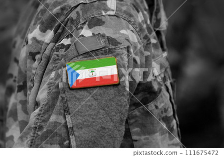 Flag of Equatorial Guinea on soldiers arm. Army, troops, military, Africa (collage). Flag of Equatorial Guinea on soldiers arm. Army, troops, military, Africa (collage). 111675472