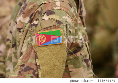 Eritrea flag on soldiers arm. State of Eritrea troops (collage) Eritrea flag on soldiers arm. State of Eritrea troops (collage) 111675475