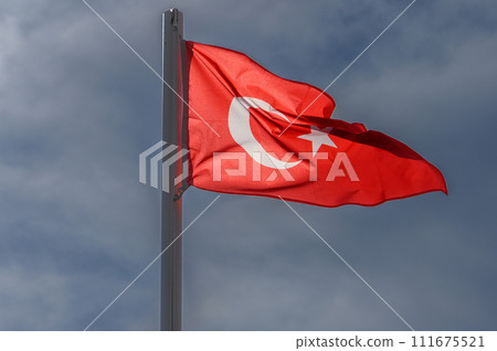 Turkish flag against the sky on a sunny winter day 3 Turkish flag against the sky on a sunny winter day 3 111675521