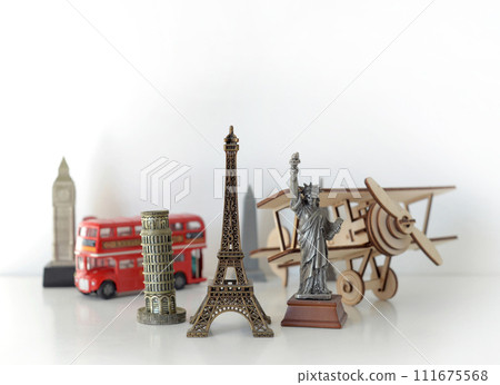 Travel and tourism concept with souvenirs from around the world. Planning summer vacation. Trip concept Travel and tourism concept with souvenirs from around the world. Planning summer vacation. Trip concept 111675568