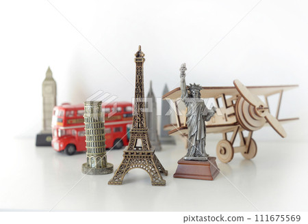 Travel and tourism concept with souvenirs from around the world. Planning summer vacation. Trip concept 111675569