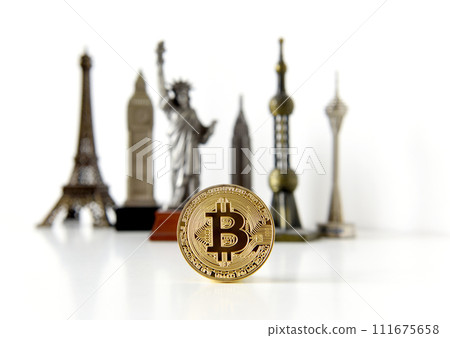 Bitcoin concept, cryptocurrencies. World economy concept. Golden coin bitcoin and souvenir from around the world. 111675658