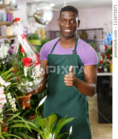 Florist giving thumbs up Florist giving thumbs up 111675871