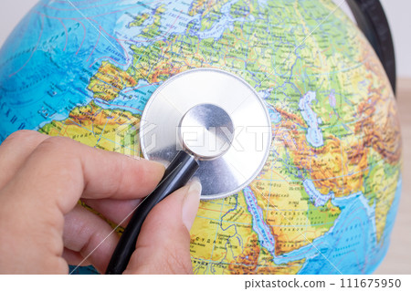 Stethoscope on a globe background close up 111675950