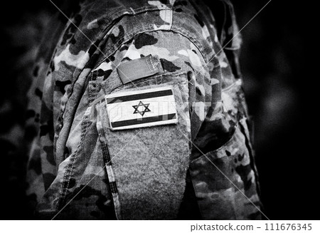 Israel flag on soldiers arm (collage). 111676345