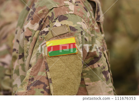 Flag of Democratic Federation of Northern Syria (DFNS) on soldiers arm. Flag of Democratic Federation of Northern Syria on military uniforms (collage). Flag of Democratic Federation of Northern Syria (DFNS) on soldiers arm. Flag of Democratic Federation of Northern Syria on military uniforms (collage). 111676353