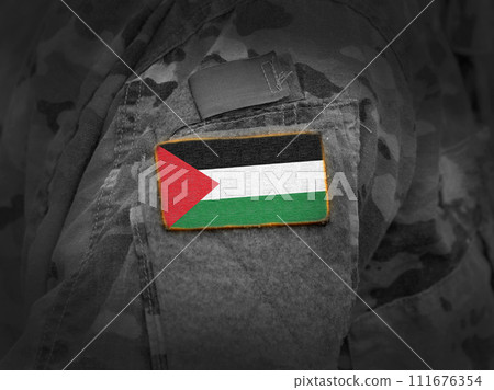 State of Palestine flag on soldiers arm (collage). 111676354