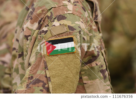 State of Palestine flag on soldiers arm (collage). 111676356