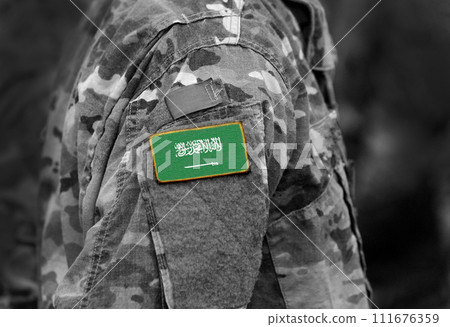 Flag of Saudi Arabia on soldiers arm (collage). 111676359
