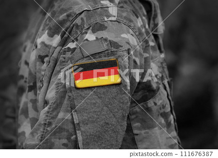 Flag of Germany on soldiers arm (collage). 111676387