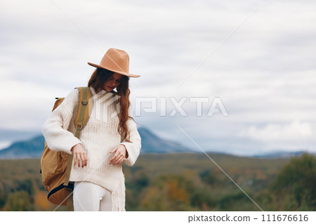 Mountain Woman Taking Selfie with Phone, Embracing the Freedom of Nature and Adventure 111676616