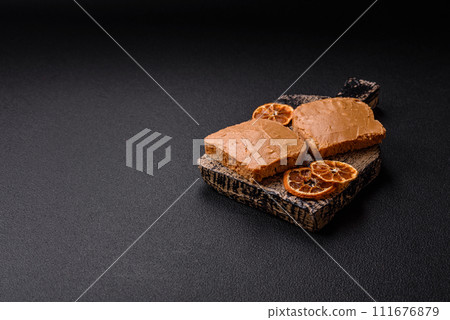 Delicious hearty sandwich with toast bread and peanut butter 111676879