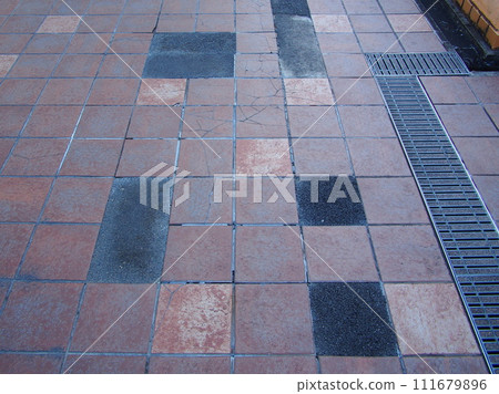 Repaired pedestrian deck tile paving 111679896