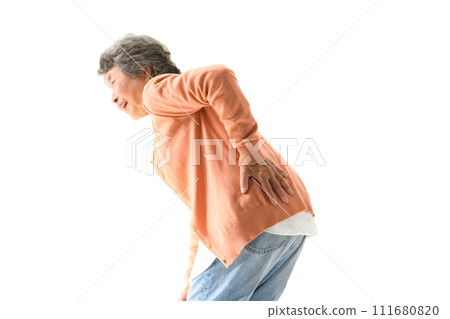 Senior woman suffering from back pain Senior woman suffering from back pain 111680820