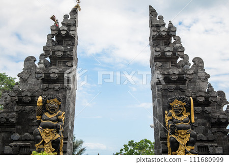 The traditional Balinese buildings called Candi bentar or split gateway, is a classical Javanese and Balinese gateway entrance commonly found at the entrance of religious compounds in Hinduism temple. The traditional Balinese buildings called Candi bentar or split gateway, is a classical Javanese and Balinese gateway entrance commonly found at the entrance of religious compounds in Hinduism temple. 111680999
