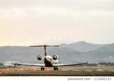 Sendai Airport at dusk, airplane taking off, Natori City, Miyagi Prefecture Sendai Airport at dusk, airplane taking off, Natori City, Miyagi Prefecture 111682125