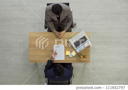 Young asian candidate presented resume to Human Resource Manager in suit during the interview. Top View 111682797