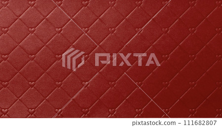Red leather-like paper background texture with heart-shaped embossment Red leather-like paper background texture with heart-shaped embossment 111682807