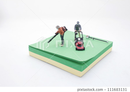 a figure of man worker trimming green on memo a figure of man worker trimming green on memo 111683131