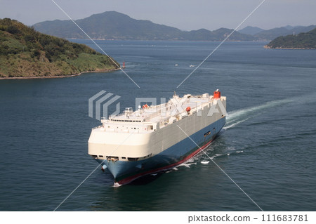 Car carrier passing through Kurushima Kaikyo Bridge 111683781