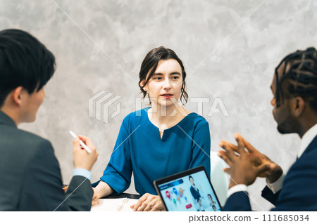 Multinational group meeting in office 111685034