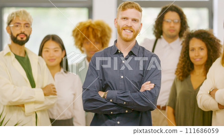 Man standing proud leading a teamwork in the office Man standing proud leading a teamwork in the office 111686059