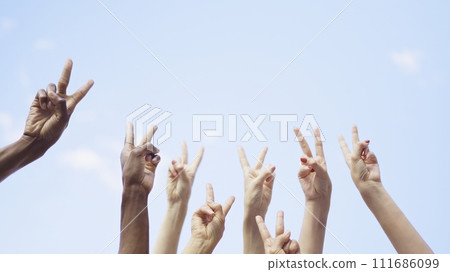 Unrecognizable group of people gesturing victory with the arms Unrecognizable group of people gesturing victory with the arms 111686099