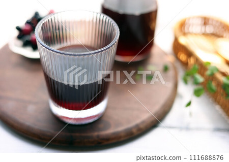 Grape juice poured into a stylish glass 111688876