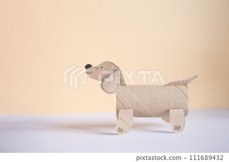a dog made out of toilet paper roll, cut out of cardboard, dachshund, kids toy, recycled paper craft concept, DIY,  a dog made out of toilet paper roll, cut out of cardboard, dachshund, kids toy, recycled paper craft concept, DIY,  111689432