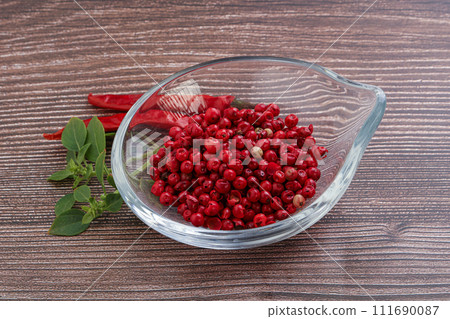 Red pepper seeds in the bowl 111690087