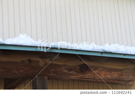 Snow on the roof of a house Snow on the roof of a house 111692241