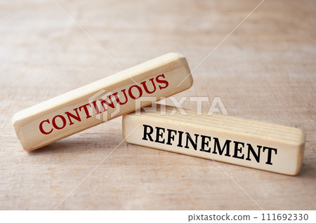 Continuous refinement text on wooden blocks. Operational excellence concept Continuous refinement text on wooden blocks. Operational excellence concept 111692330