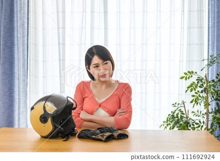 A woman waiting for a bike touring companion A woman waiting for a bike touring companion 111692924