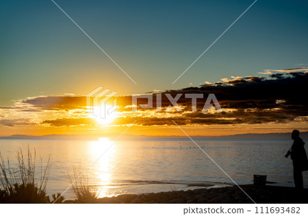 Person watching the sunset 111693482