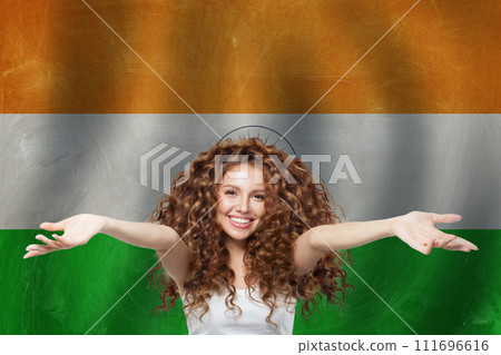 Happy woman on Indian flag background. Travel, learn hindi language and India concept Happy woman on Indian flag background. Travel, learn hindi language and India concept 111696616