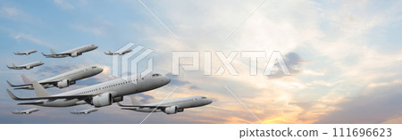 Planes flying on sunset sky with white cloud. Flight, fly and aircraft concept. Planes flying on sunset sky with white cloud. Flight, fly and aircraft concept. 111696623