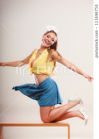 Seductive pin up woman girl dancing on table. Seductive pin up woman girl dancing on table. 111696758