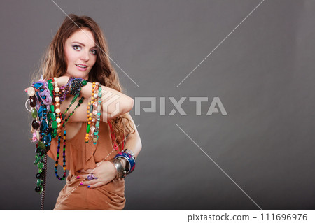 Pretty woman with jewelry necklaces ring bracelets 111696976