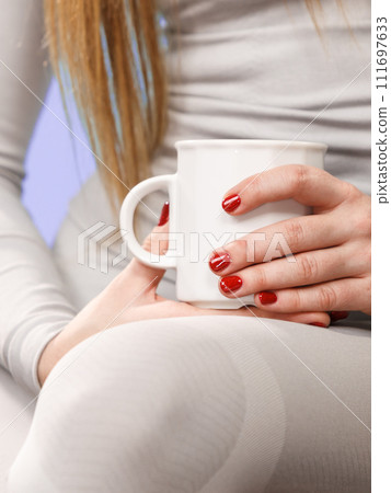 girl in thermal underwear drinking tea 111697633