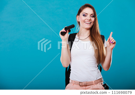 Tourist woman with binoculars on blue Tourist woman with binoculars on blue 111698079