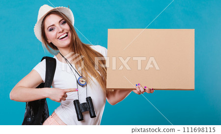 Summer traveler woman hitchhiking with blank sign Summer traveler woman hitchhiking with blank sign 111698115