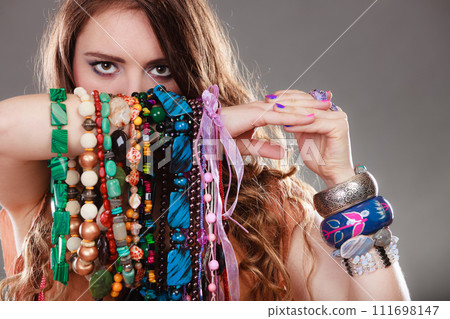 Pretty woman with jewelry necklaces ring bracelets 111698147